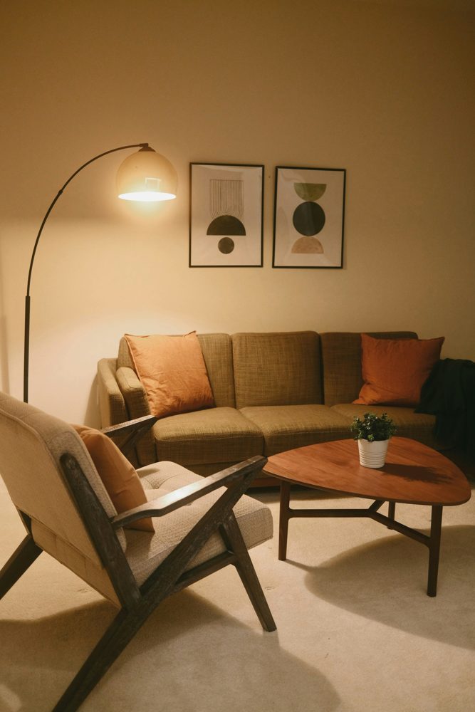 A warm living room with soft lamplight